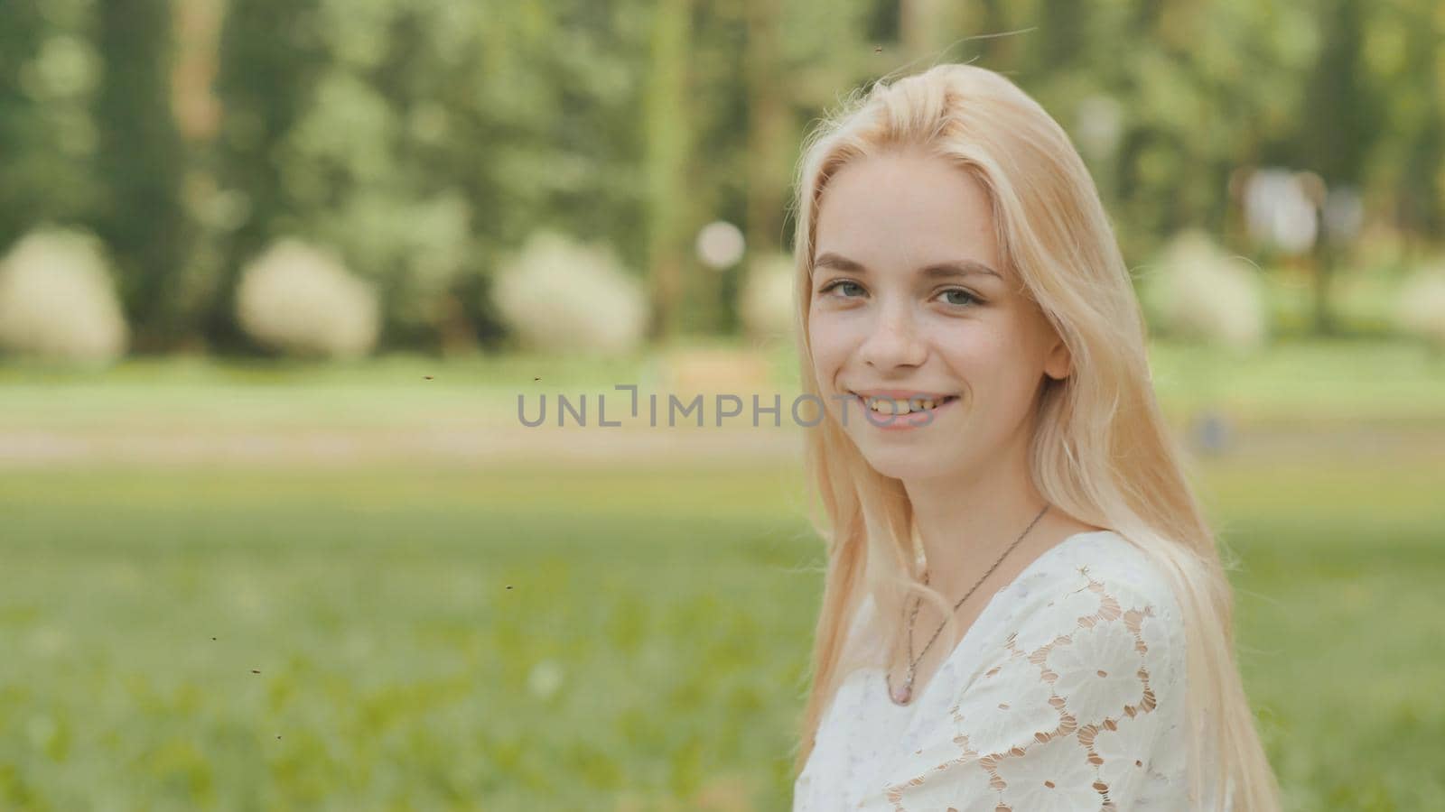 Close-up face of a smiling 19 year old blonde girl. by DovidPro