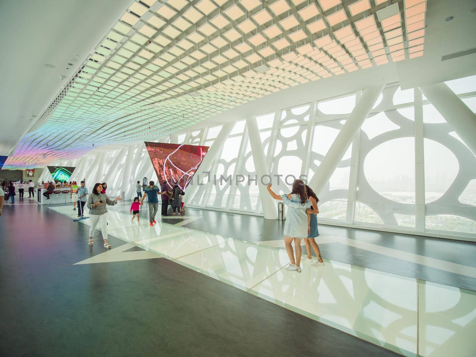 The interior of the building with visitors to Dubai Frame.