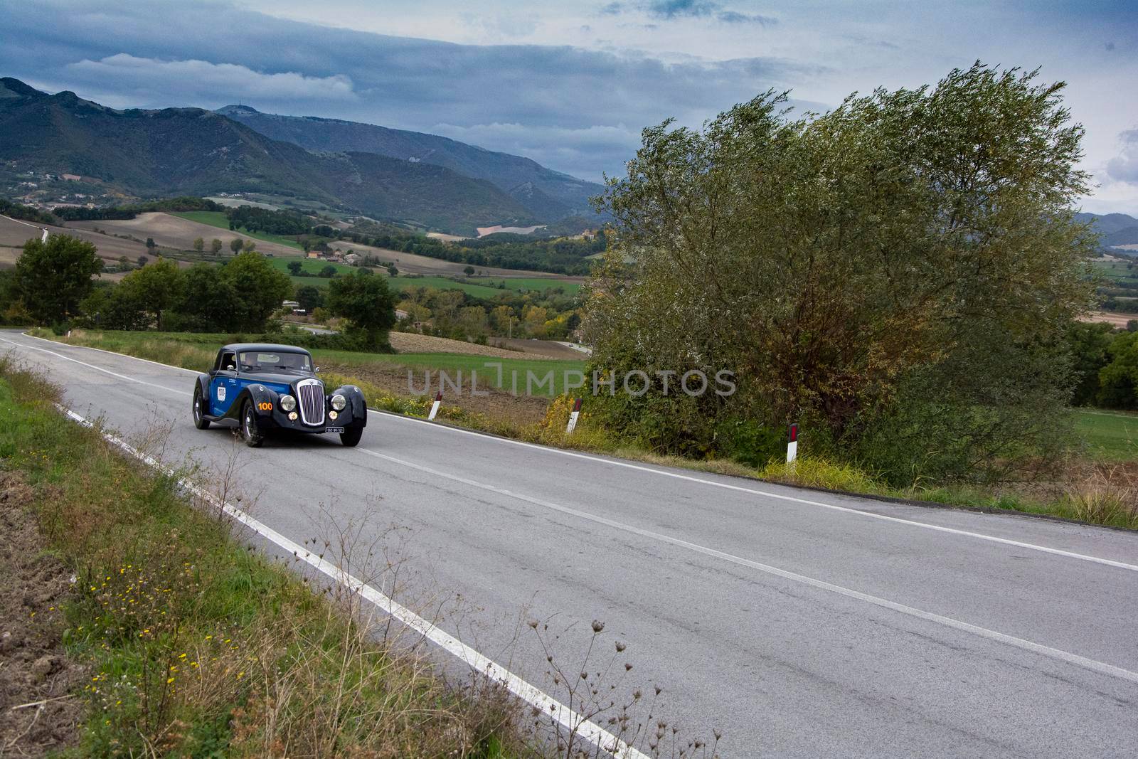 CAGLI , ITALY - OTT 24 - 2020 : LANCIA ASTURA 1938 on an old racing car in rally Mille Miglia 2020 the famous italian historical race (1927-1957