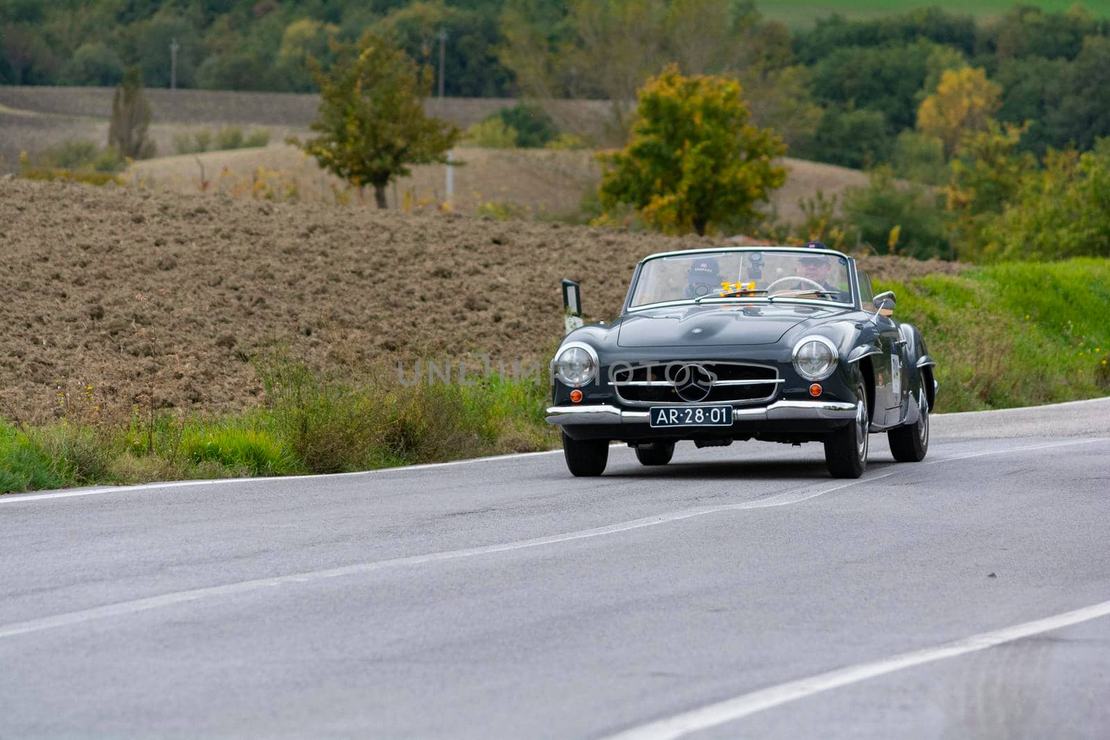 CAGLI , ITALY - OTT 24 - 2020 : MERCEDES-BENZ 190 SL 1955 on an old racing car in rally Mille Miglia 2020 the famous italian historical race (1927-1957