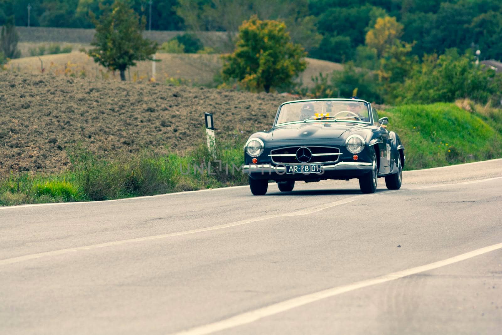 CAGLI , ITALY - OTT 24 - 2020 : MERCEDES-BENZ 190 SL 1955 on an old racing car in rally Mille Miglia 2020 the famous italian historical race (1927-1957