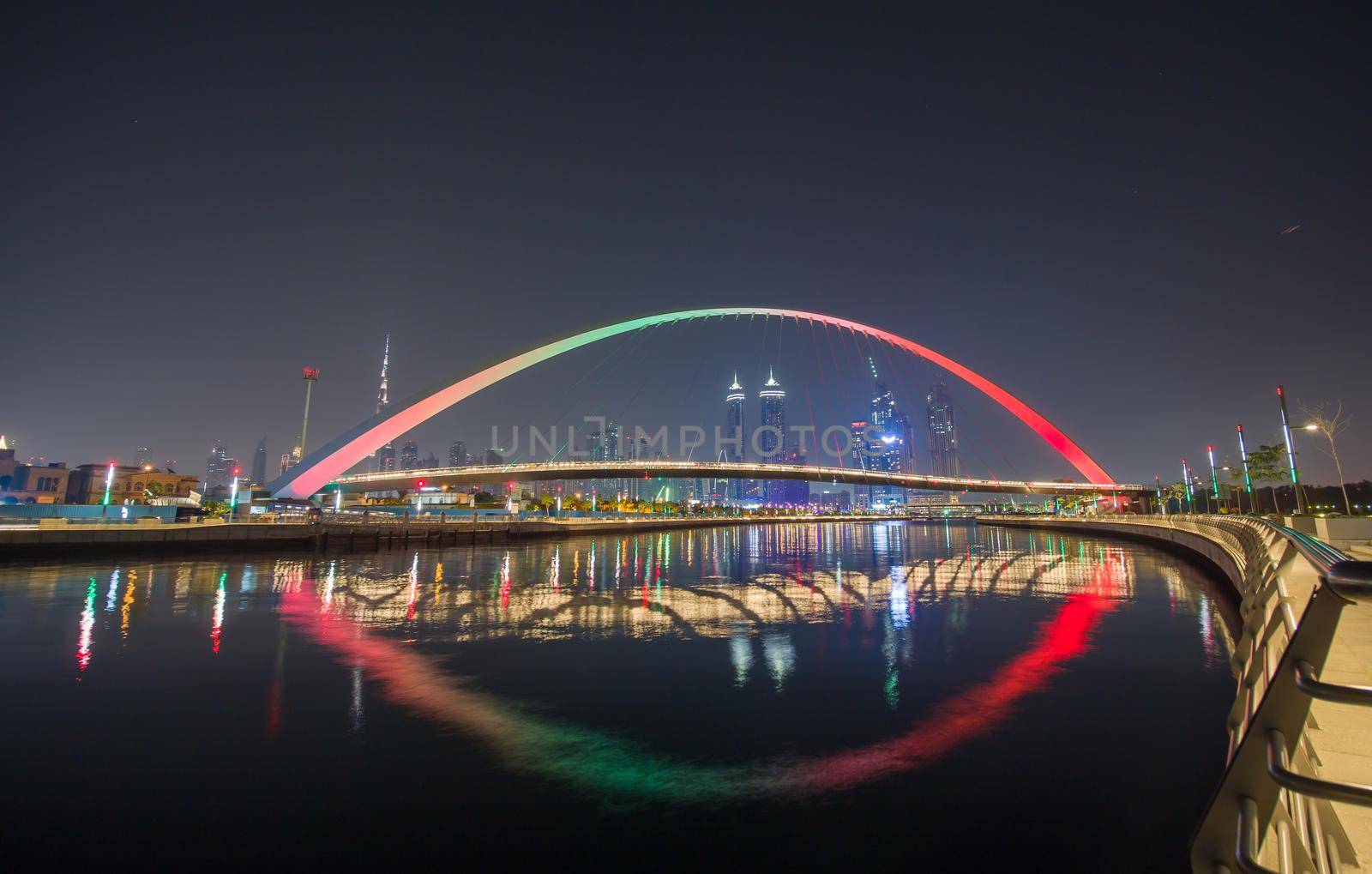 Panorama of night Dubai on the background of the bridge of the Dubai Greek canal. by DovidPro