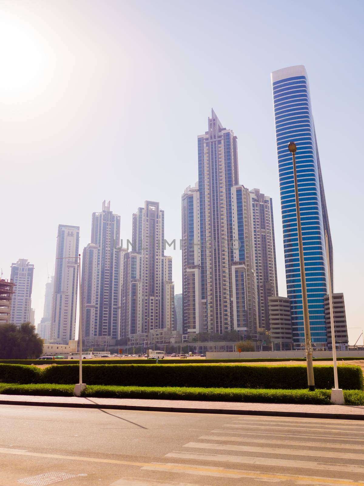 Streets with modern skyscrapers of the city of Dubai. by DovidPro