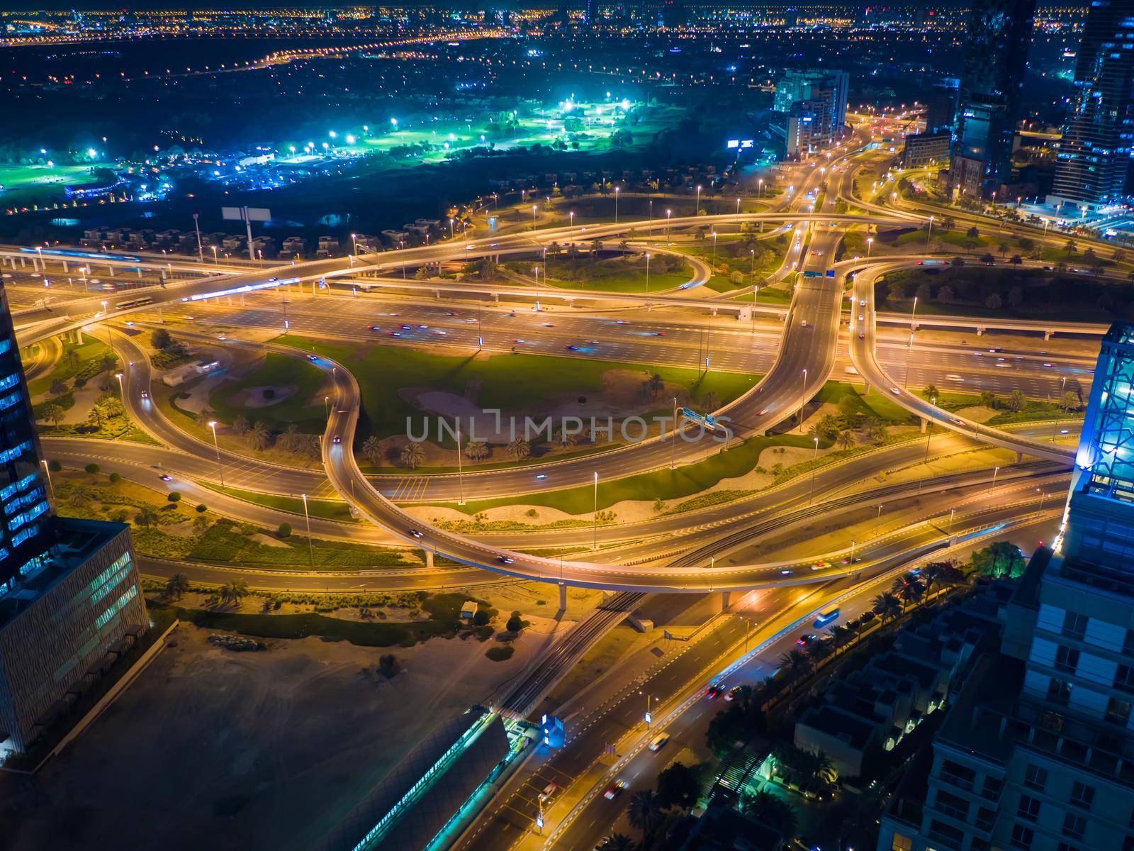 Big road junction in Dubai at night. by DovidPro