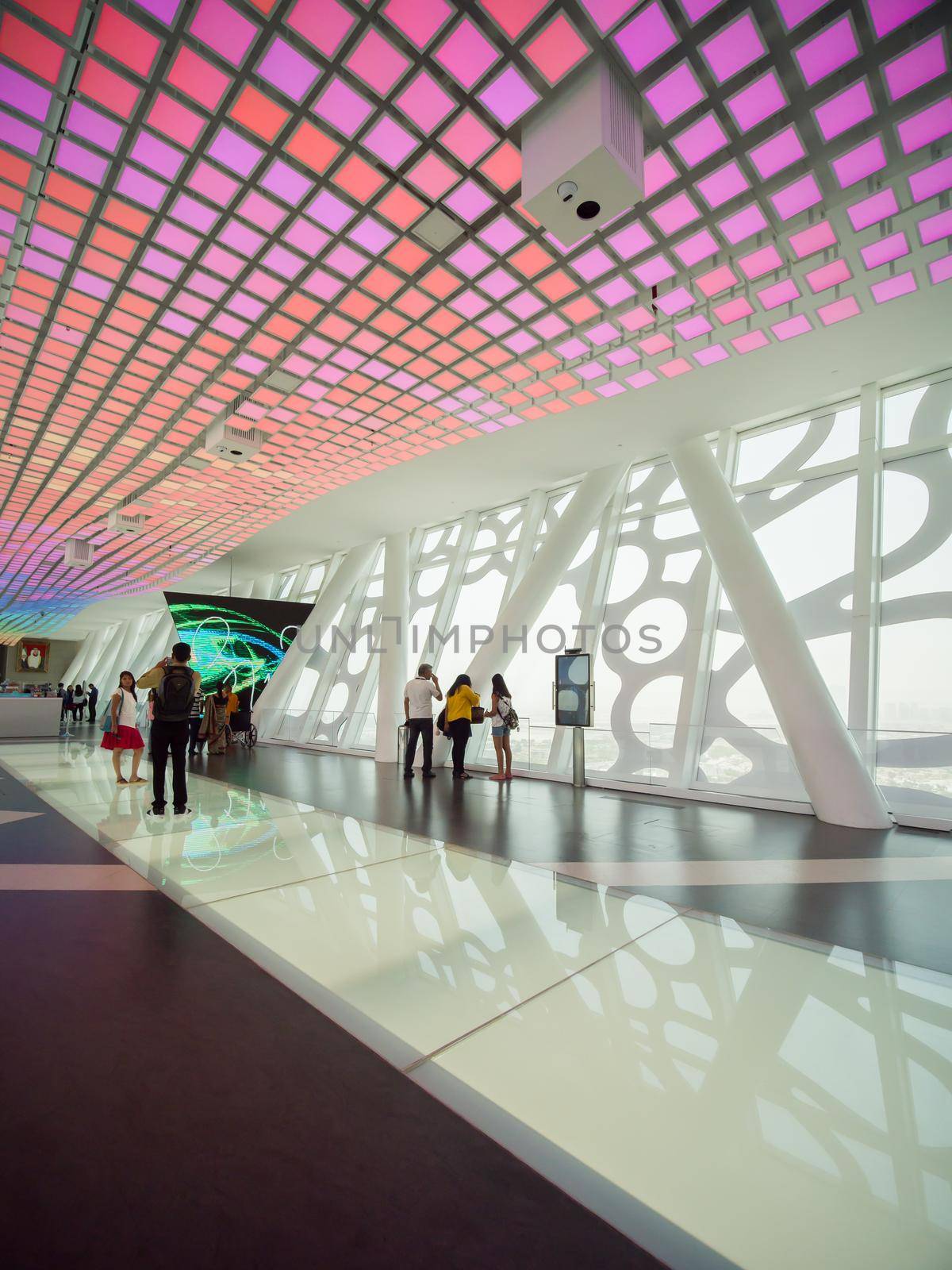 The interior of the building with visitors to Dubai Frame.