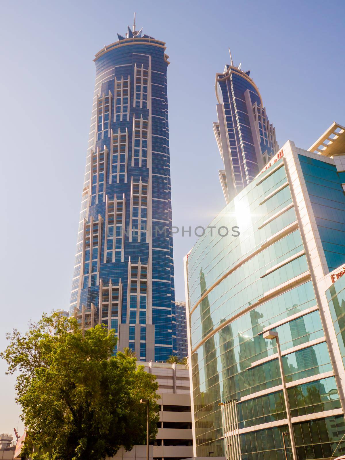 Dubai, UAE - May 15, 2018: Streets with modern skyscrapers of the city of Dubai by DovidPro