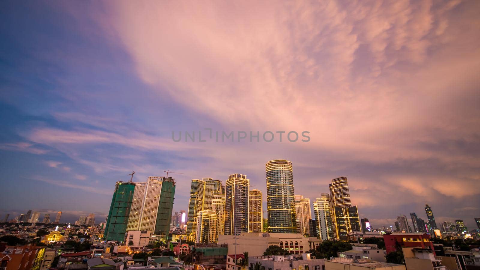 The capital of the Philippines is Manila. Makati city. Beautiful sunset with thunderous powerful clouds