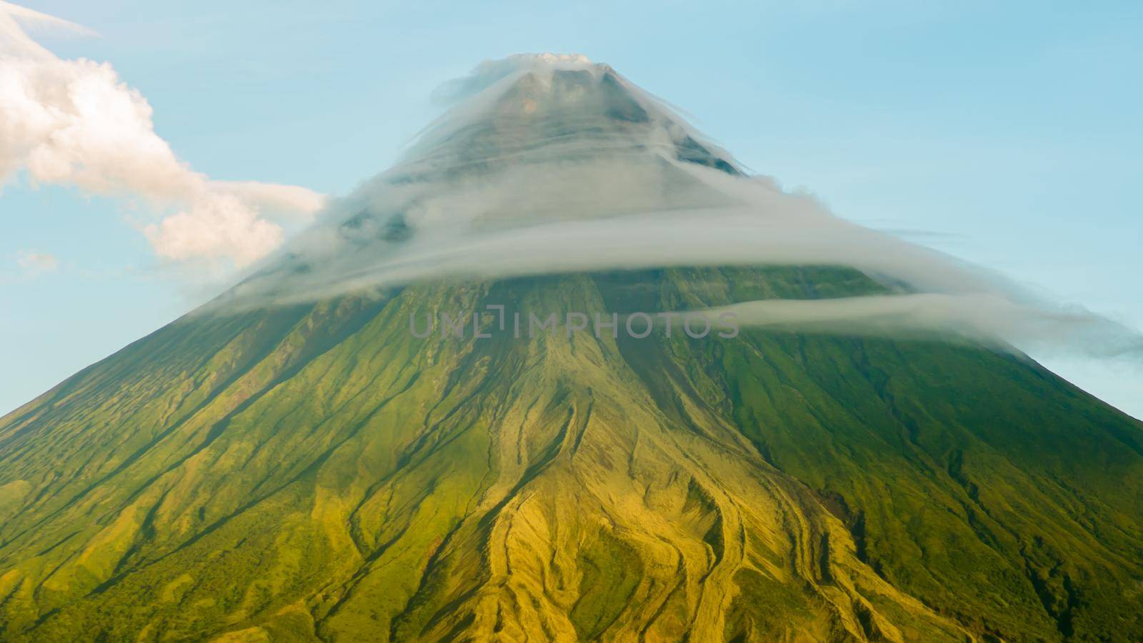 Mayon Volcano is an active stratovolcano in the province of Albay in Bicol Region, on the island of Luzon in the Philippines. Renowned as the perfect cone because of its symmetric conical shape. by DovidPro