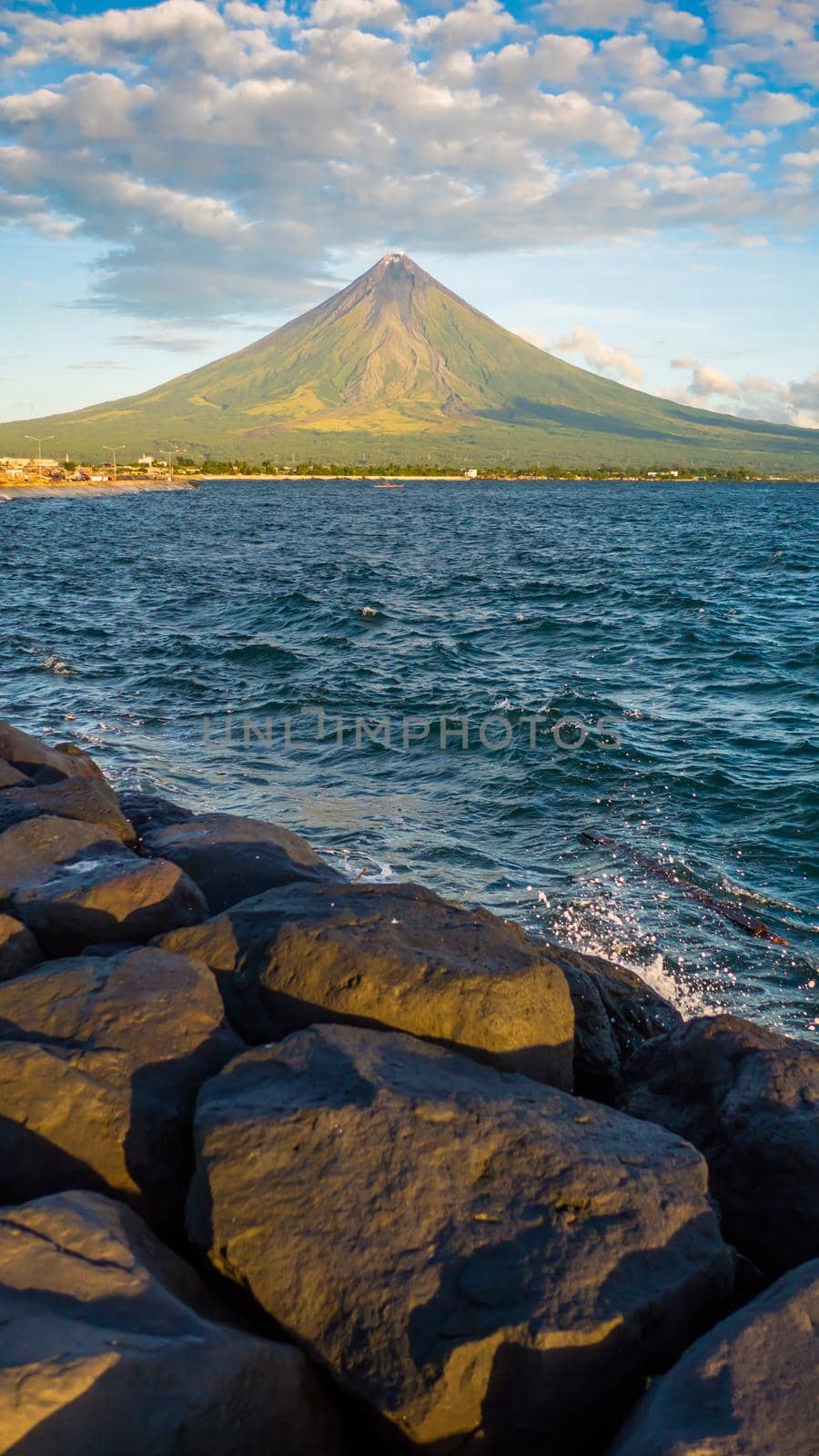 Mayon Volcano is an active stratovolcano in the province of Albay in Bicol Region, on the island of Luzon in the Philippines. Renowned as the perfect cone because of its symmetric conical shape. by DovidPro