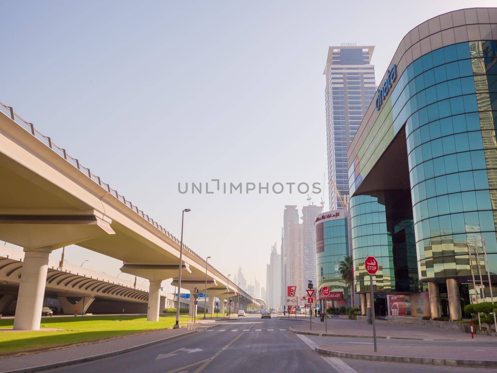 Dubai, UAE - May 15, 2018: Streets with modern skyscrapers of the city of Dubai. by DovidPro