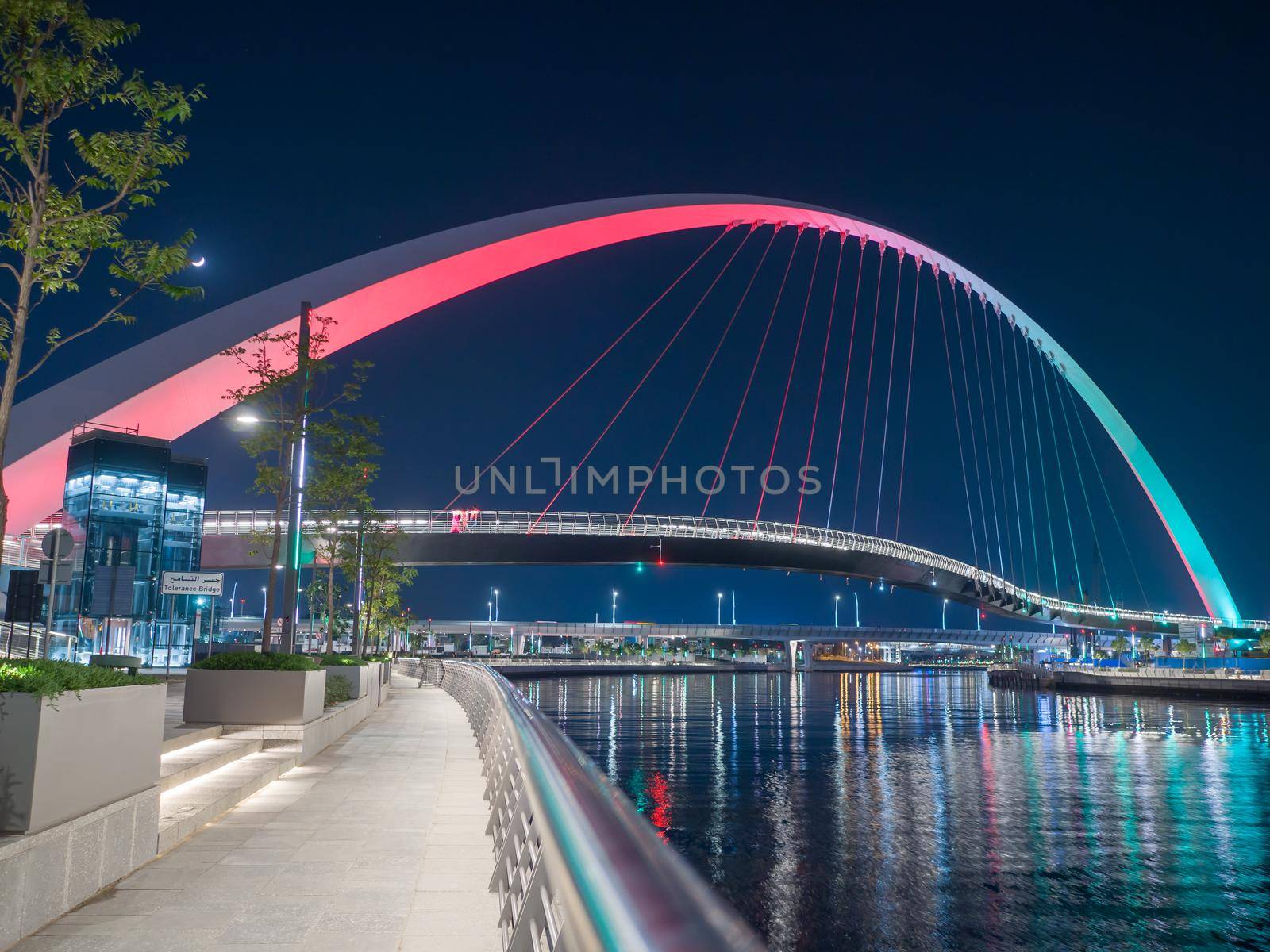 Panorama of night Dubai on the background of the bridge of the Dubai Greek canal. by DovidPro