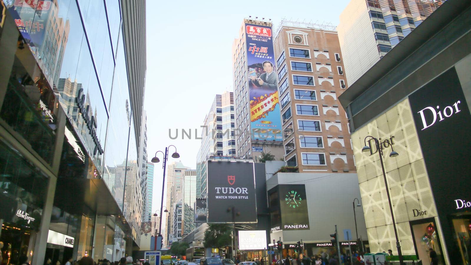 Hong Kong, China - January 1, 2016: Central streets of Hong Kong. Billboards. Shopping centers and fashion shops. High-rise architectural infrastructure. Hotels. Places of entertainment and recreation. by DovidPro