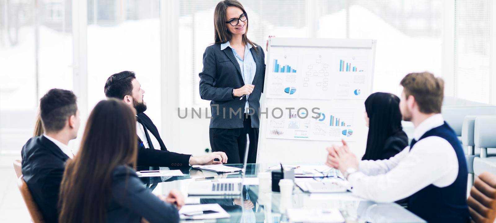 business team gives a presentation of a new financial project for the business partners of the company . the photo has a empty space for your text.