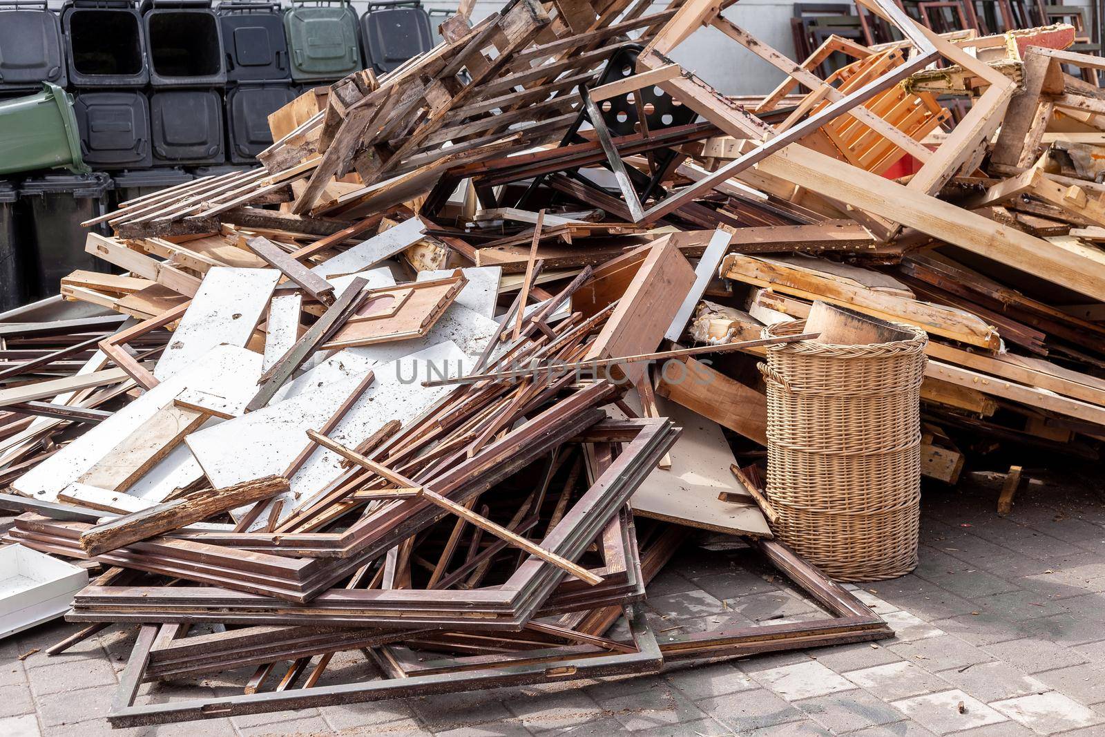 Recycling dump with trash of broken window and door frames, furniture and more