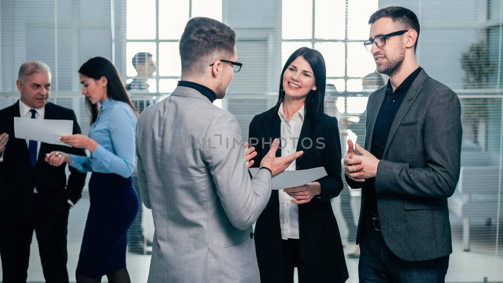 group of business people standing in the office lobby. business concept