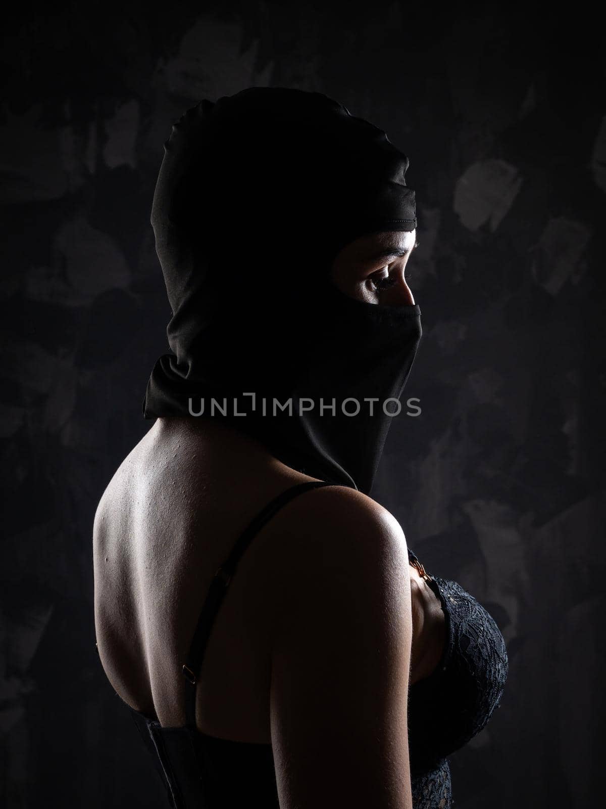 Portrait of a girl in a black balaclava and a black bra. by Evgenii_Leontev