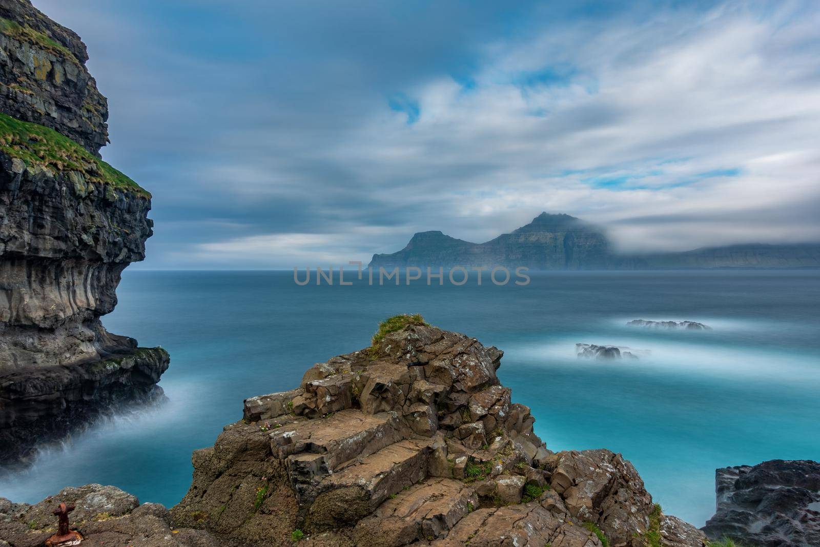 Dramatic ultra long exposure of viewpoint over the ocean in Faroe Islands