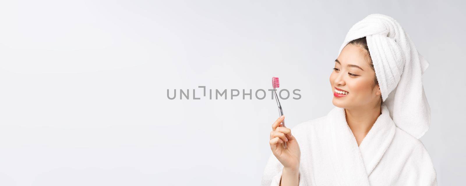 Close up of Smile woman brush teeth. great for health dental care concept, Isolated over white background. asian. by Benzoix