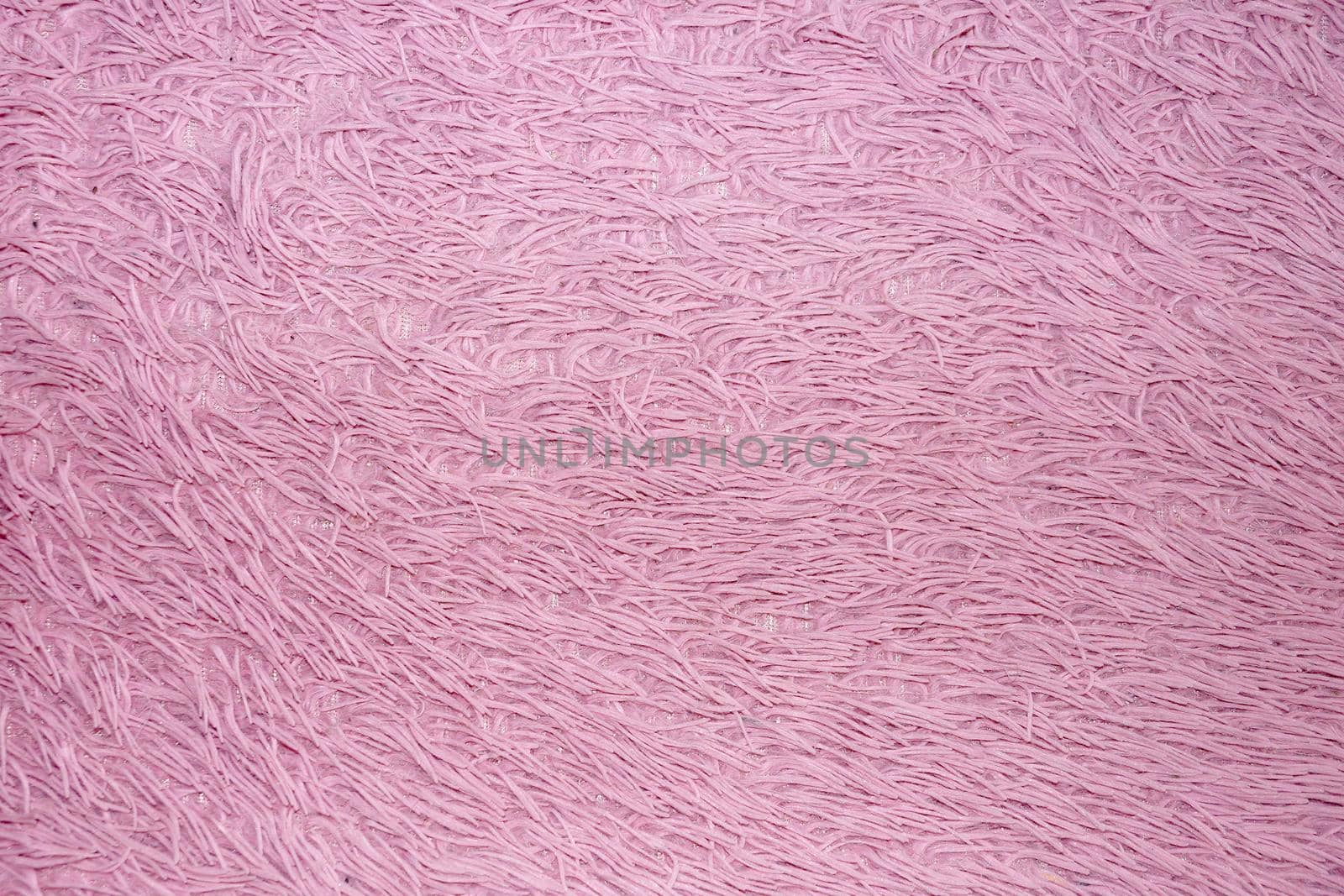 pink faux fur for textile fur background close-up by Annado
