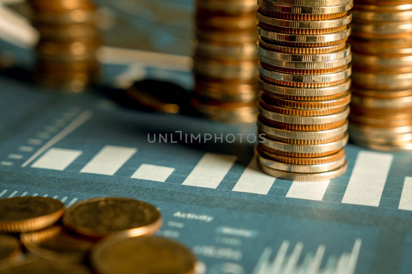 Pile of gold coins stack in finance treasury deposit bank account for saving by biancoblue