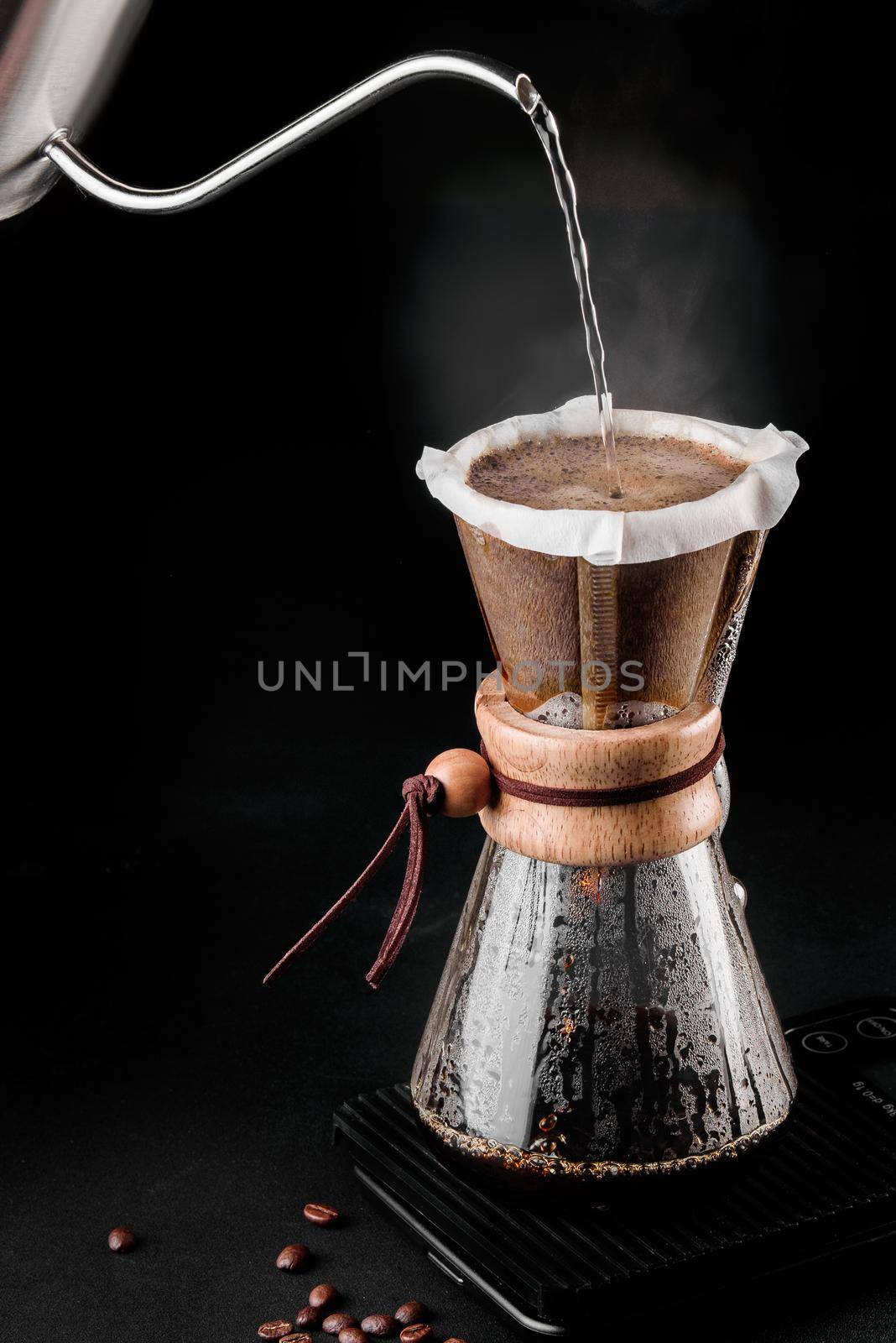 Chemex coffeemaker is a manual pour-over style glass coffeemaker. Chemex is a device for brewing coffee. Coffee brewing by Rabizo