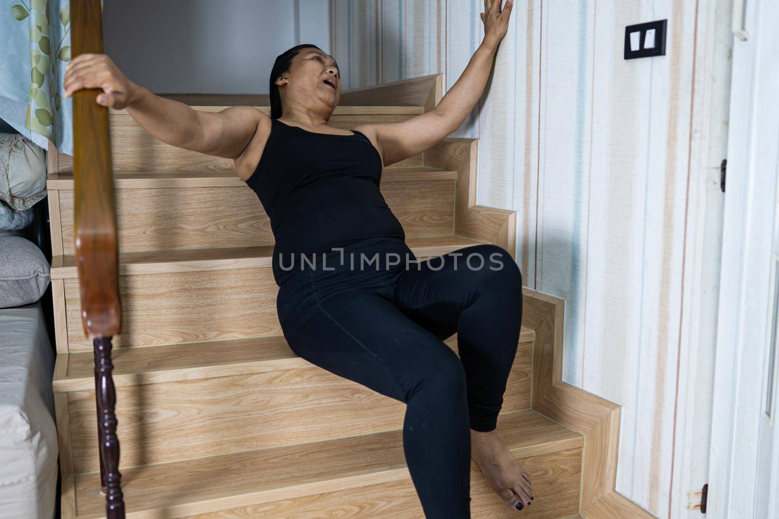 Asian lady woman patient fall down the stairs because slippery surfaces by pamai