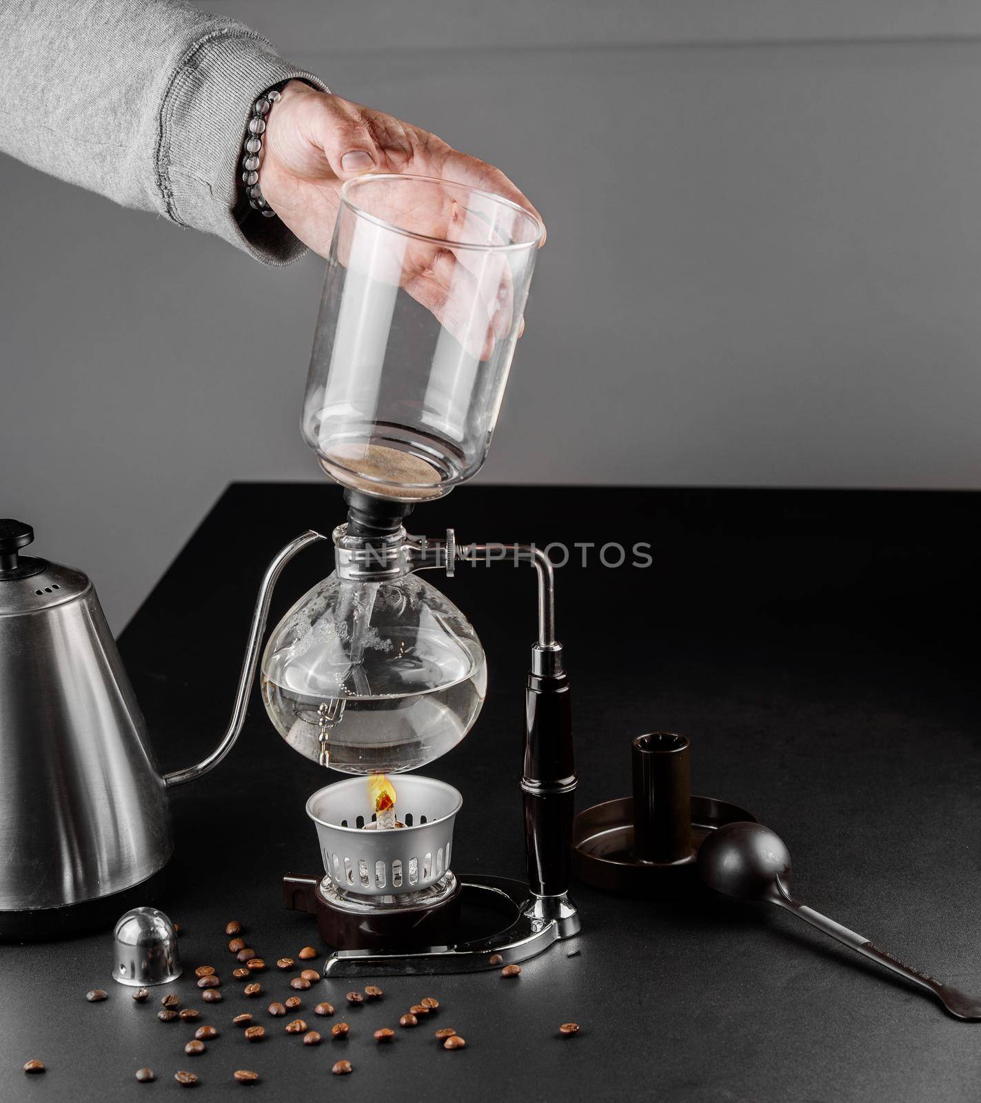 Syphon alternative method of making coffee. coffeemaker is a manual pour-over style glass. Cofee brewing. by Rabizo