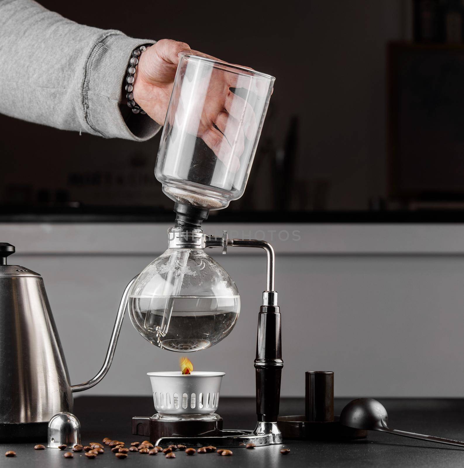 Syphon alternative method of making coffee. coffeemaker is a manual pour-over style glass. Cofee brewing