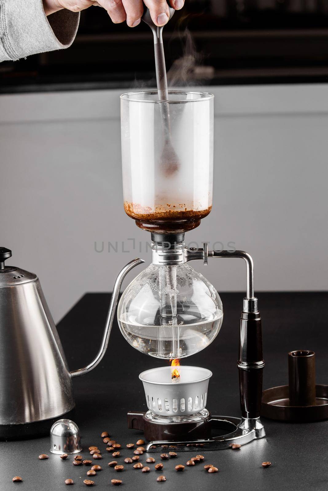 Syphon alternative method of making coffee. coffeemaker is a manual pour-over style glass. Cofee brewing. by Rabizo