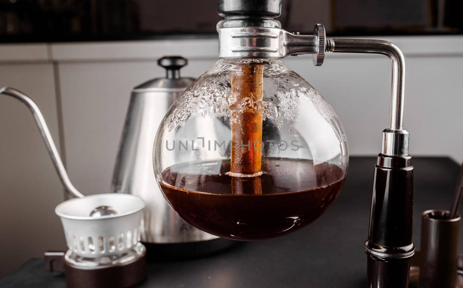 Syphon alternative method of making coffee. coffeemaker is a manual pour-over style glass. Cofee brewing. by Rabizo