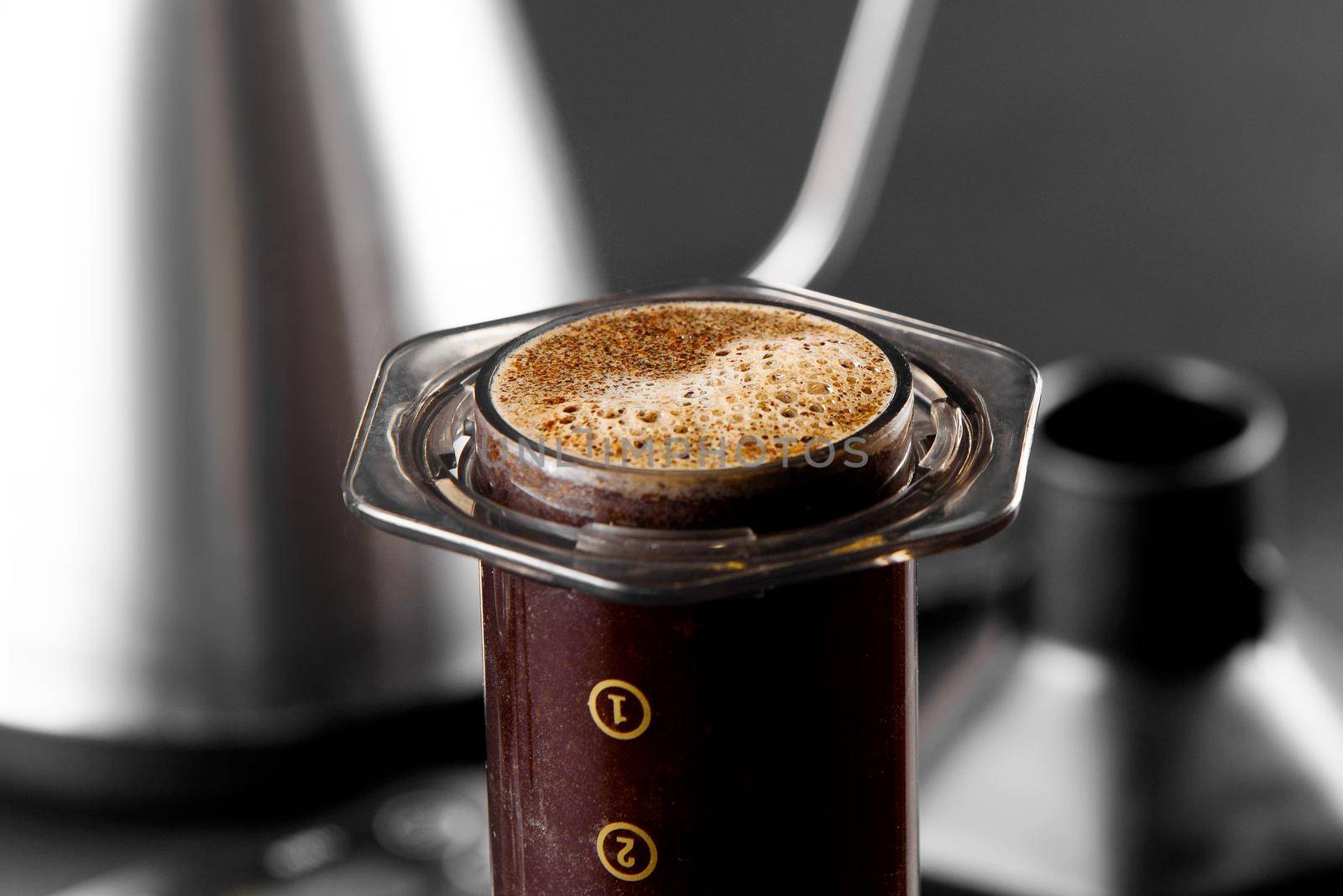 AeroPress on black background .The AeroPress is a device for brewing coffee. Coffee brewing.