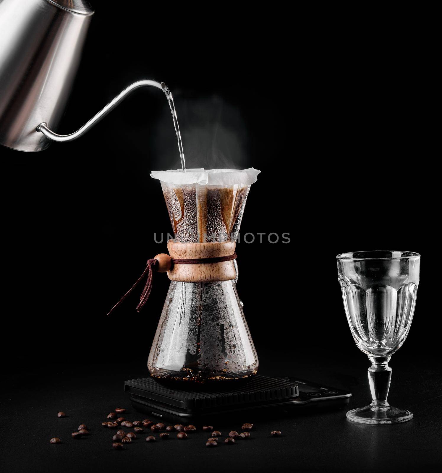 Chemex coffeemaker is a manual pour-over style glass coffeemaker. Chemex is a device for brewing coffee. Coffee brewing by Rabizo