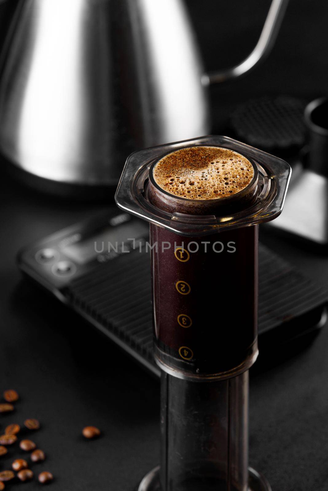 AeroPress on black background .The AeroPress is a device for brewing coffee. Coffee brewing by Rabizo