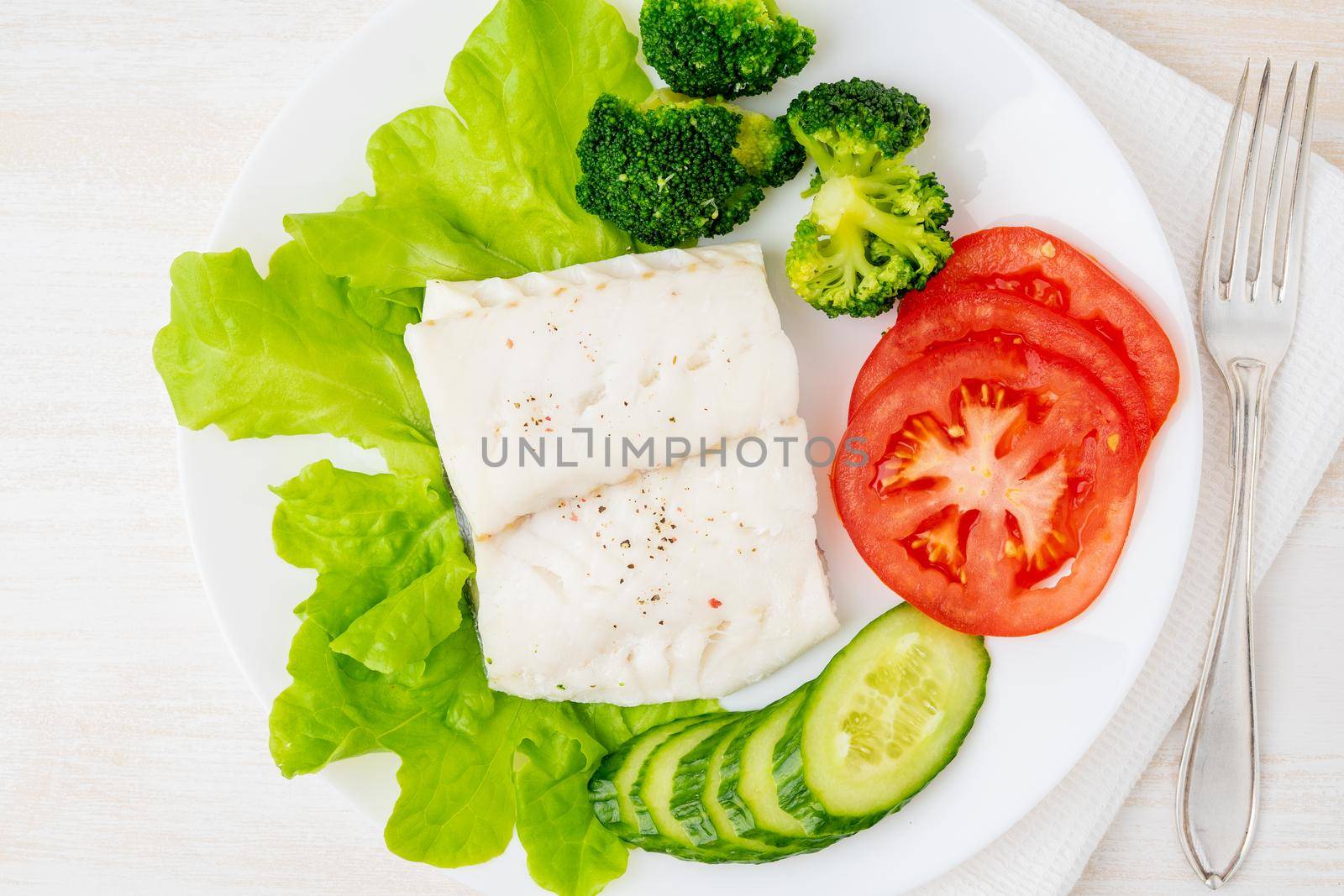 Steamed cod fish. Paleo, keto, fodmap healthy diet with vegetables by NataBene