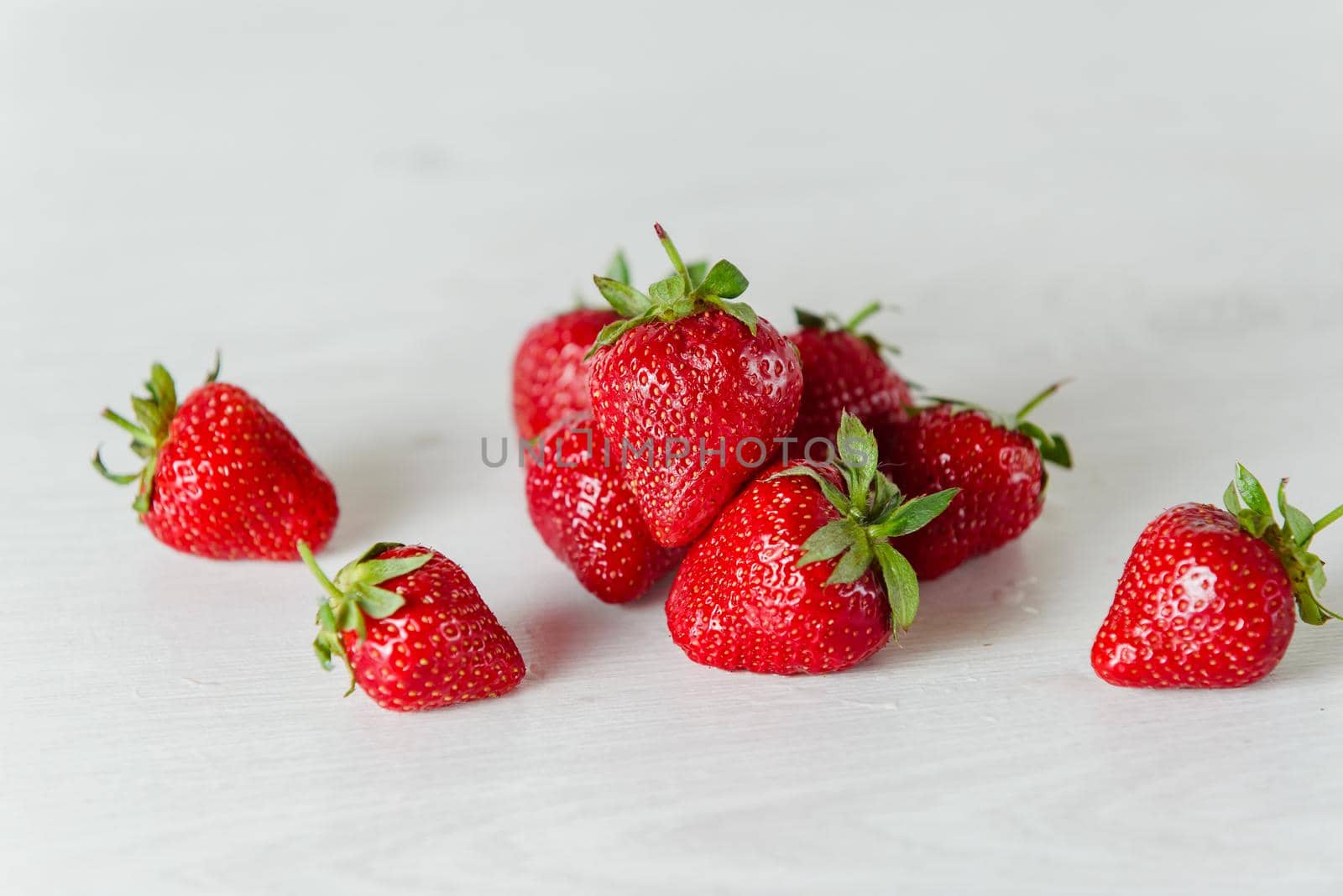 Red strawberry healthy vitamin berry isolated on white background. by Rabizo