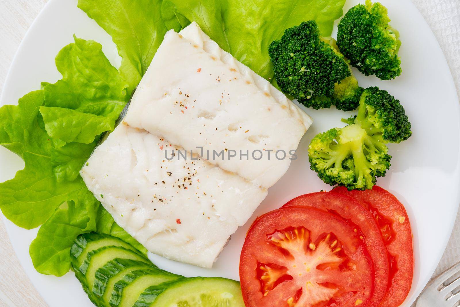 Steamed cod fish. Paleo, keto, fodmap healthy diet with vegetables by NataBene