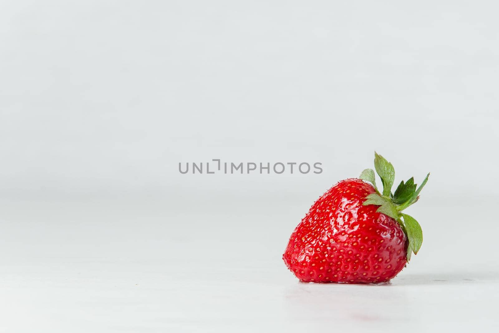 Red strawberry healthy vitamin berry isolated on white background. by Rabizo