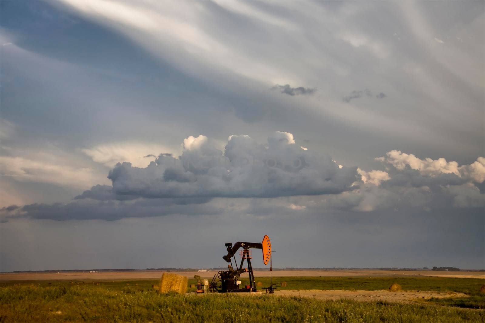 Prairie Storm Clouds Saskatchewan oil pump jack