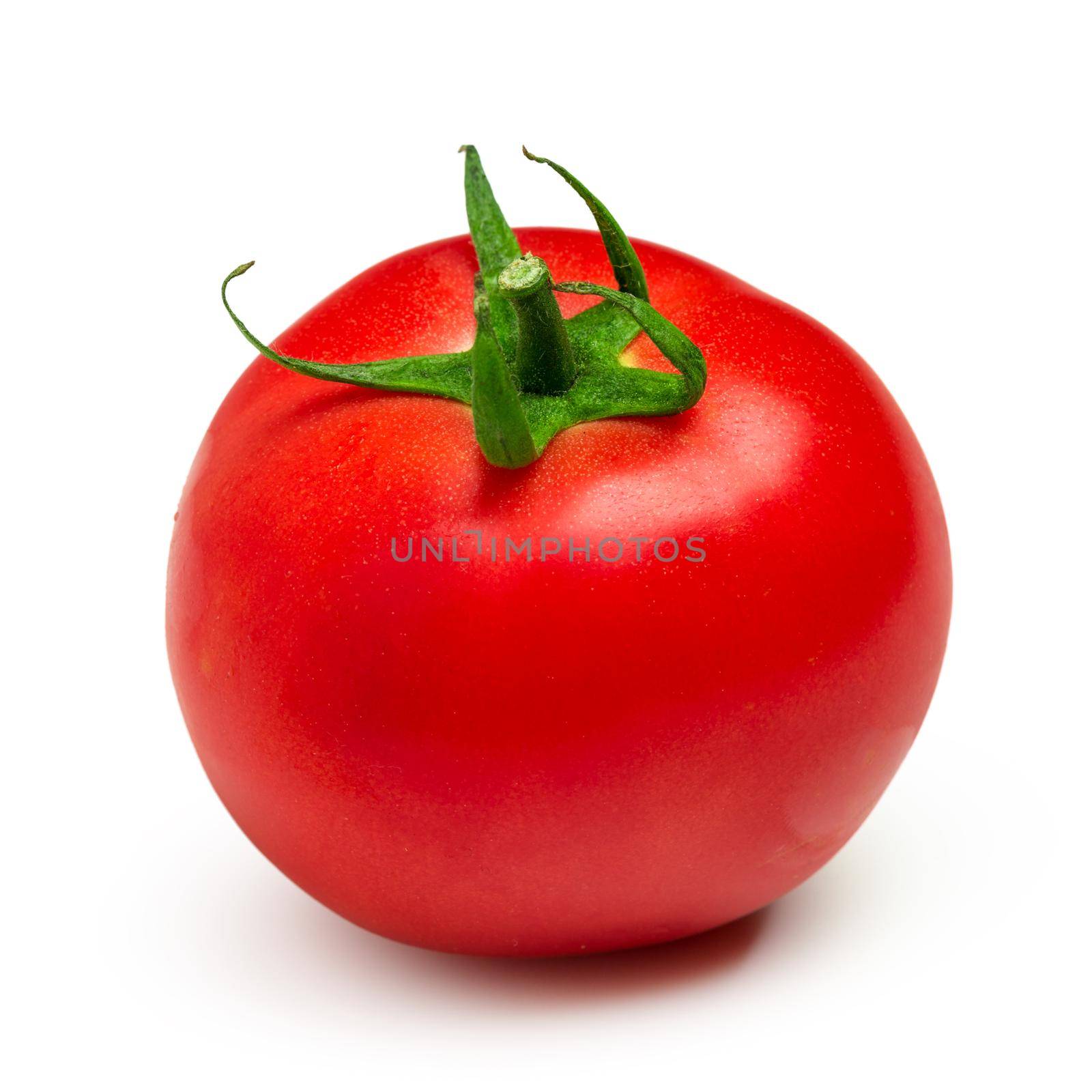 Ripe red tomato isolated on white background. Close up.
