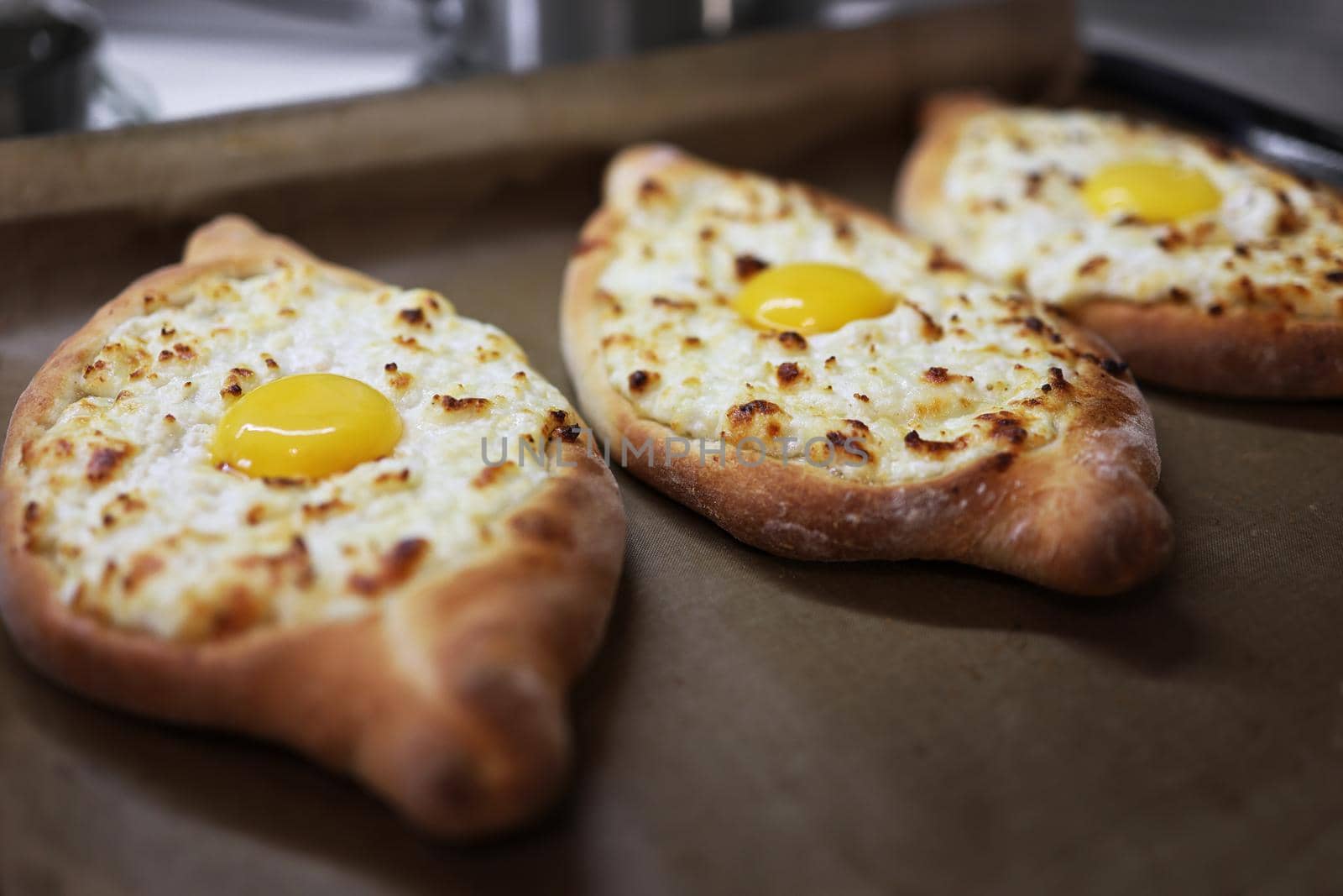 Khachapuri in Adjarian. Open pie with mozzarella and egg. Traditional Georgian cuisine. Step by step. Step 2.