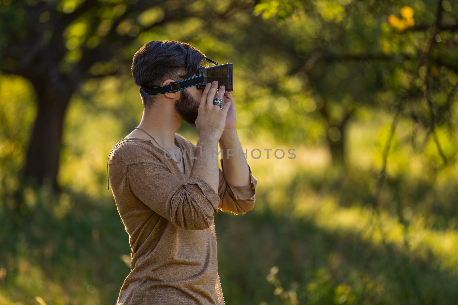 man wearing virtual reality glasses by zokov