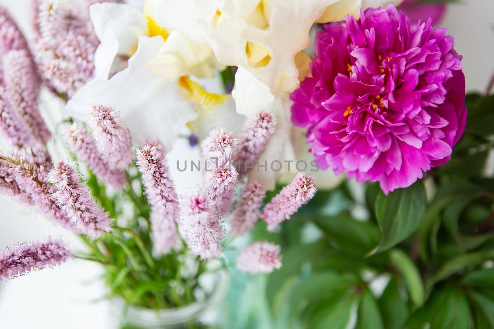 Beautiful bouquet of different beautiful flowers. The concept of the work of a florist in a flower shop. by sfinks