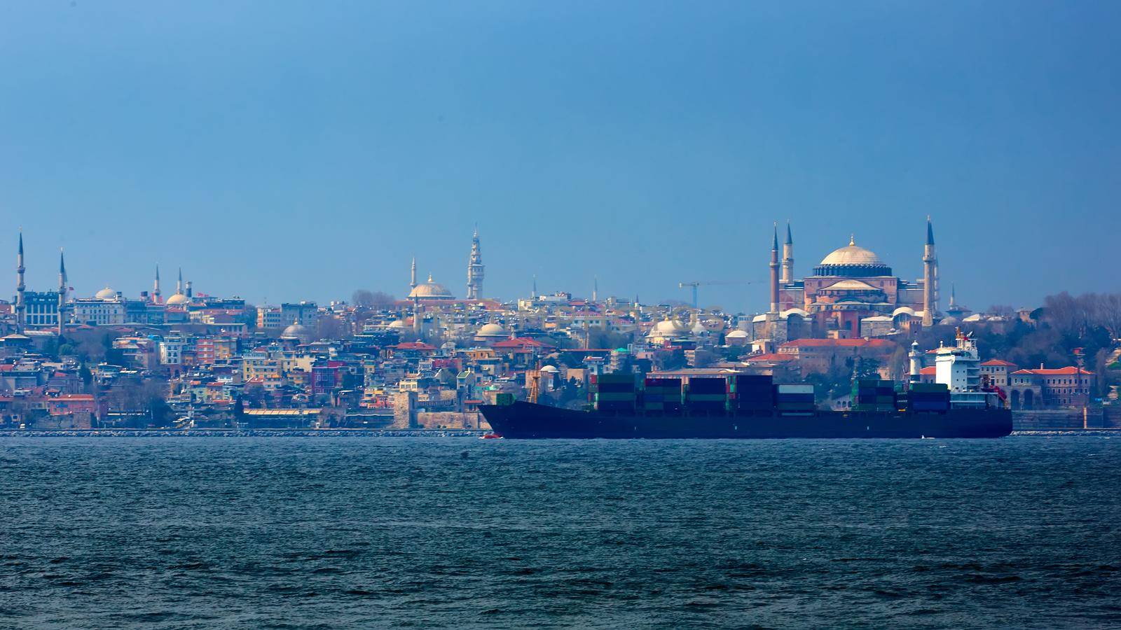 Container ship in Bosphorus with Old City in Background Hagia Sophia. Istanbul, Turkey