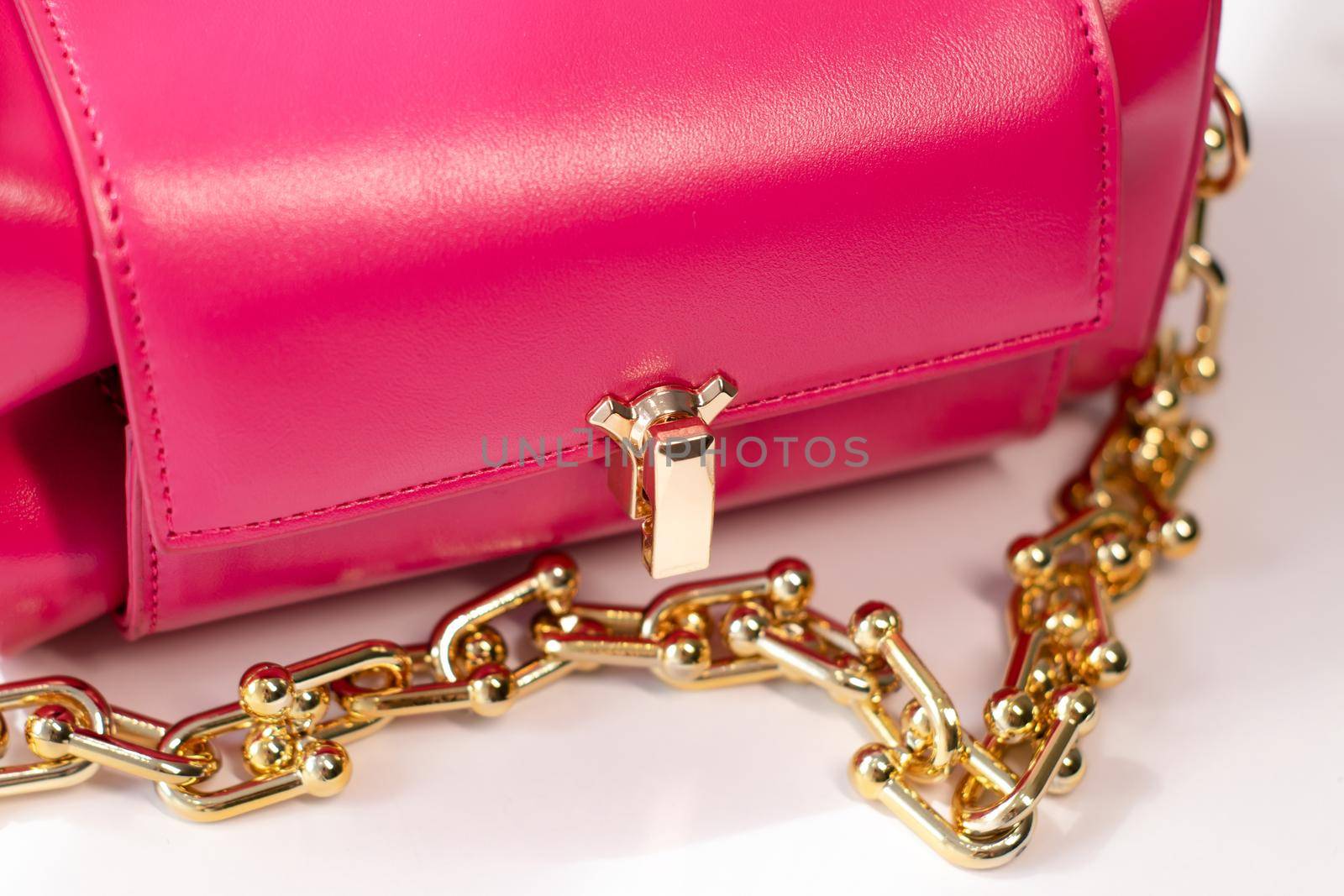 pink little handbag with gold chain isolated on white background. Product photography. bags and purses by oliavesna