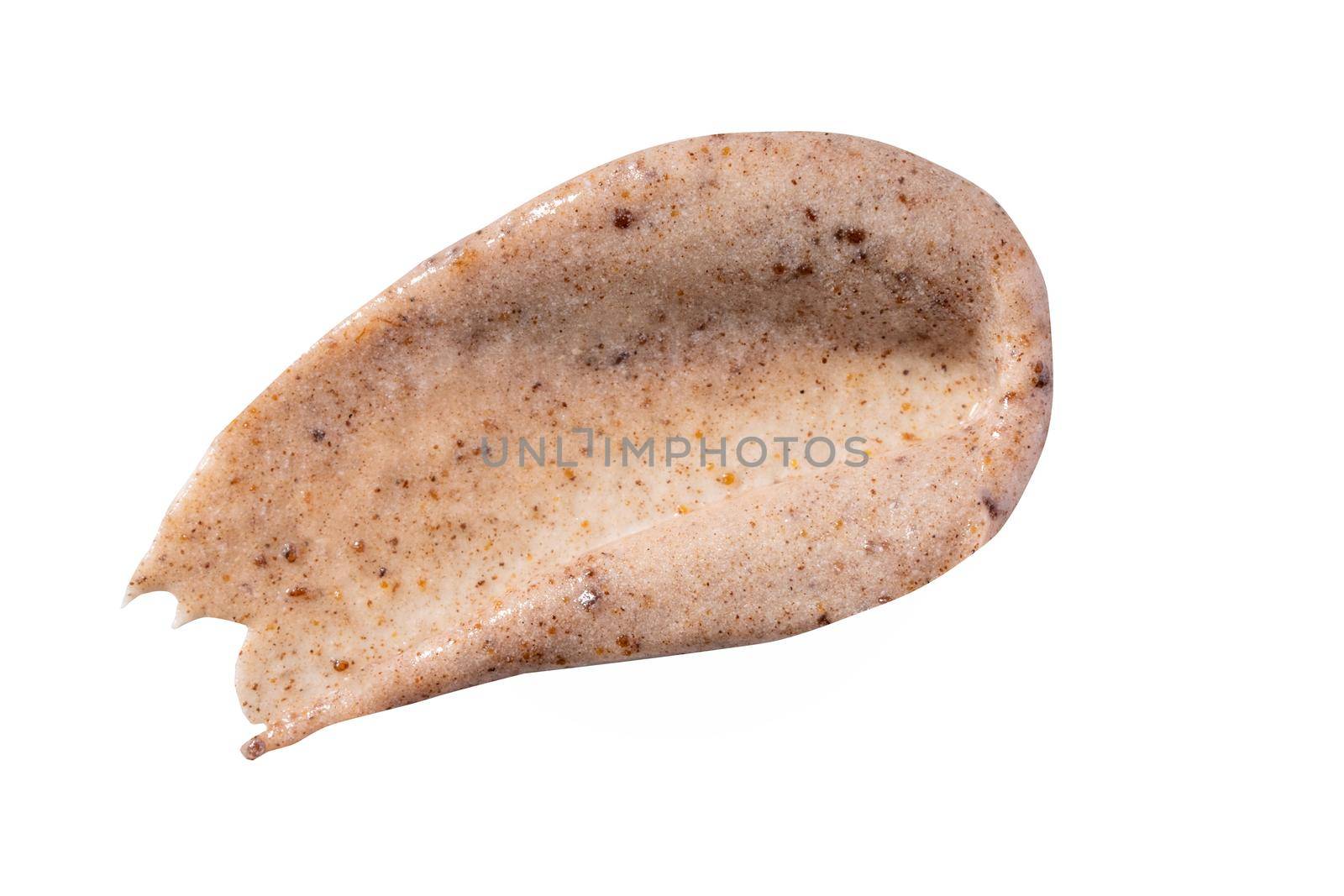 Peeling cream smudge with exfoliating particles. Cosmetic skincare product with abrasive particle sample, gentle nude scrub texture isolate. Scrub smear swatch isolated on white background.