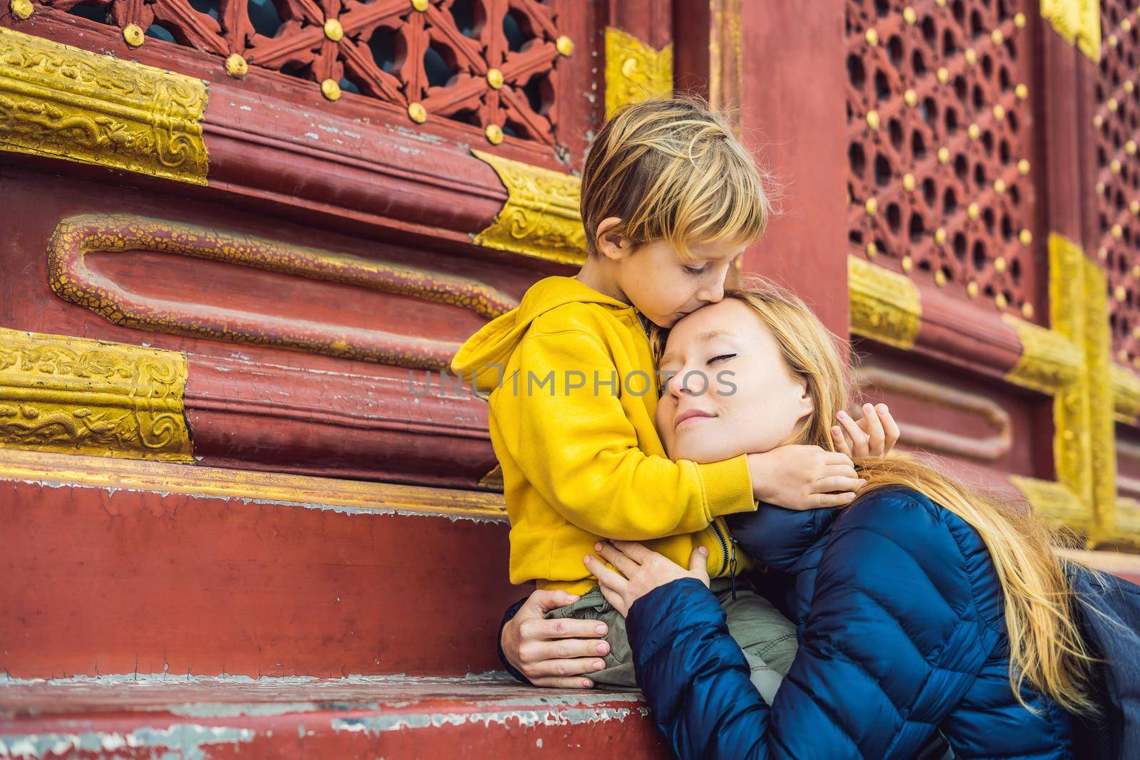 Mom and son travelers in the Temple of Heaven in Beijing. One of the main attractions of Beijing. Traveling with family and kids in China concept.