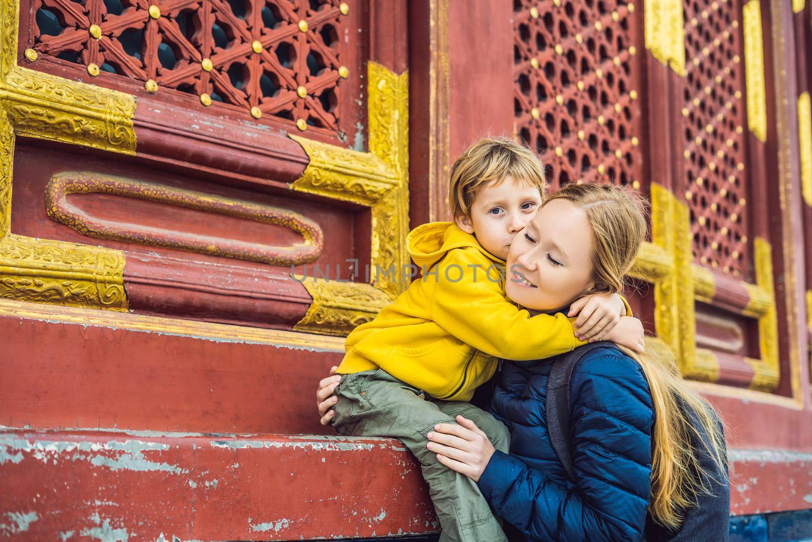 Mom and son travelers in the Temple of Heaven in Beijing. One of the main attractions of Beijing. Traveling with family and kids in China concept.