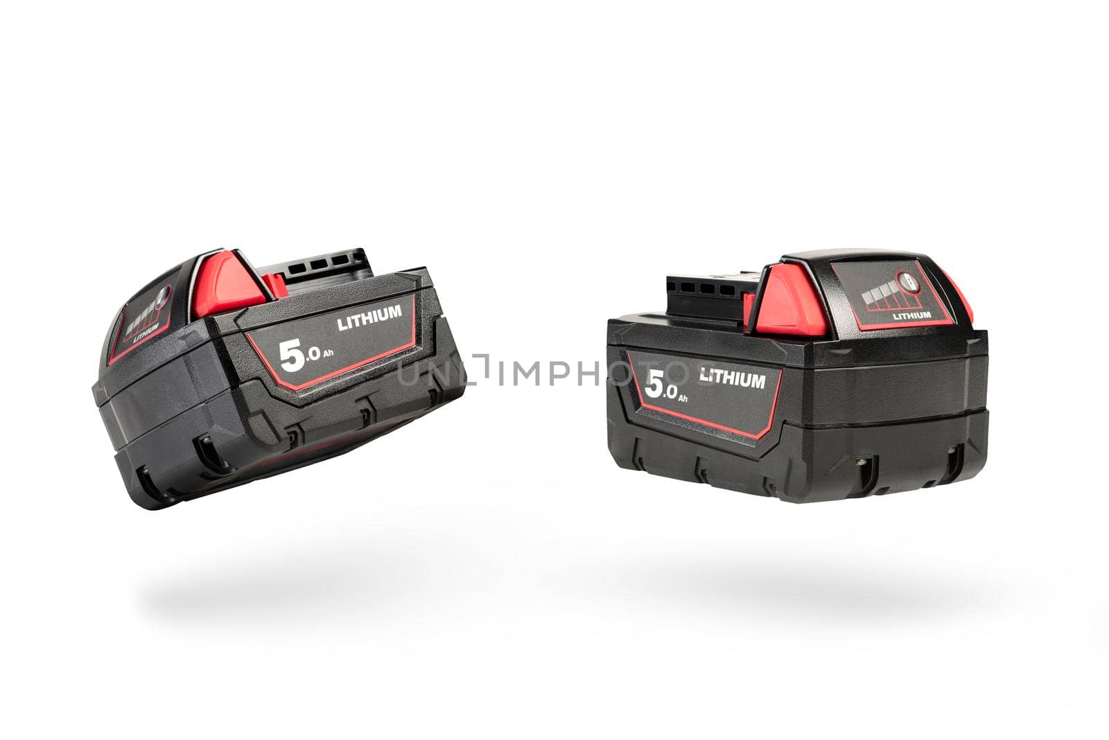 Batteries for cordless tools. Screwdriver battery. Batteries with charge indicator isolated on white background with shadow.