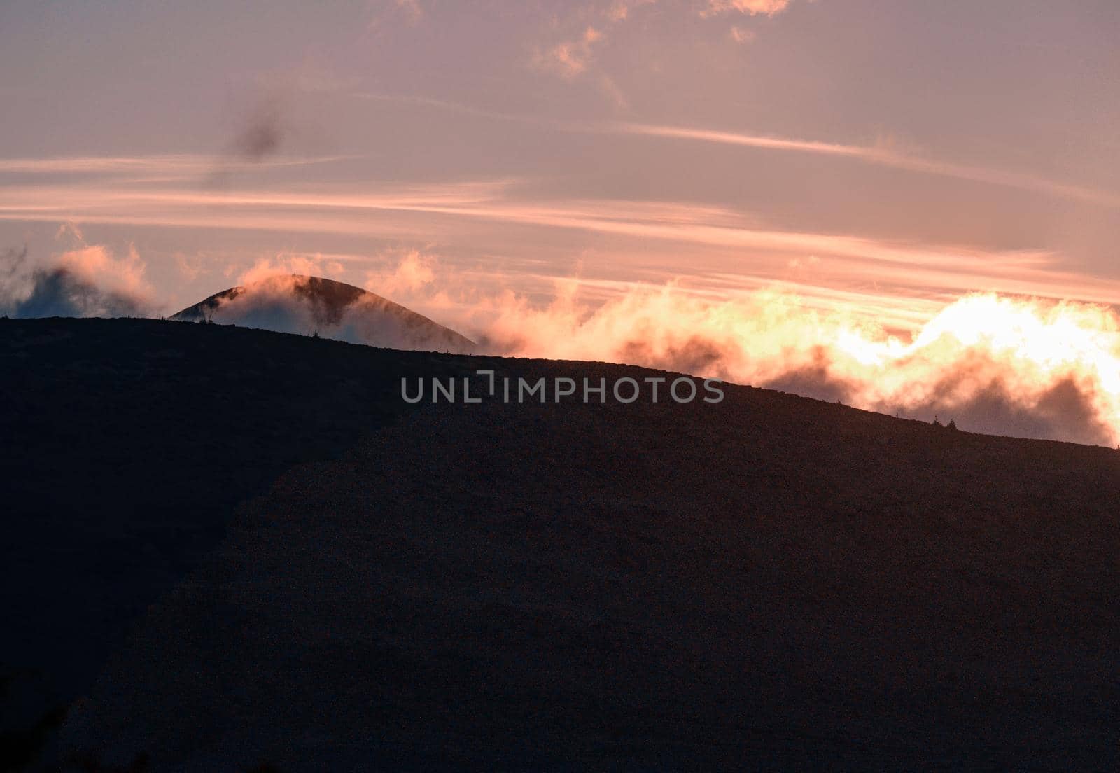 Petros Mountain in the morning fog, overcast mountain range at dawn, magical mountains of Ukraine, panoramas of the Ukrainian Carpathians.