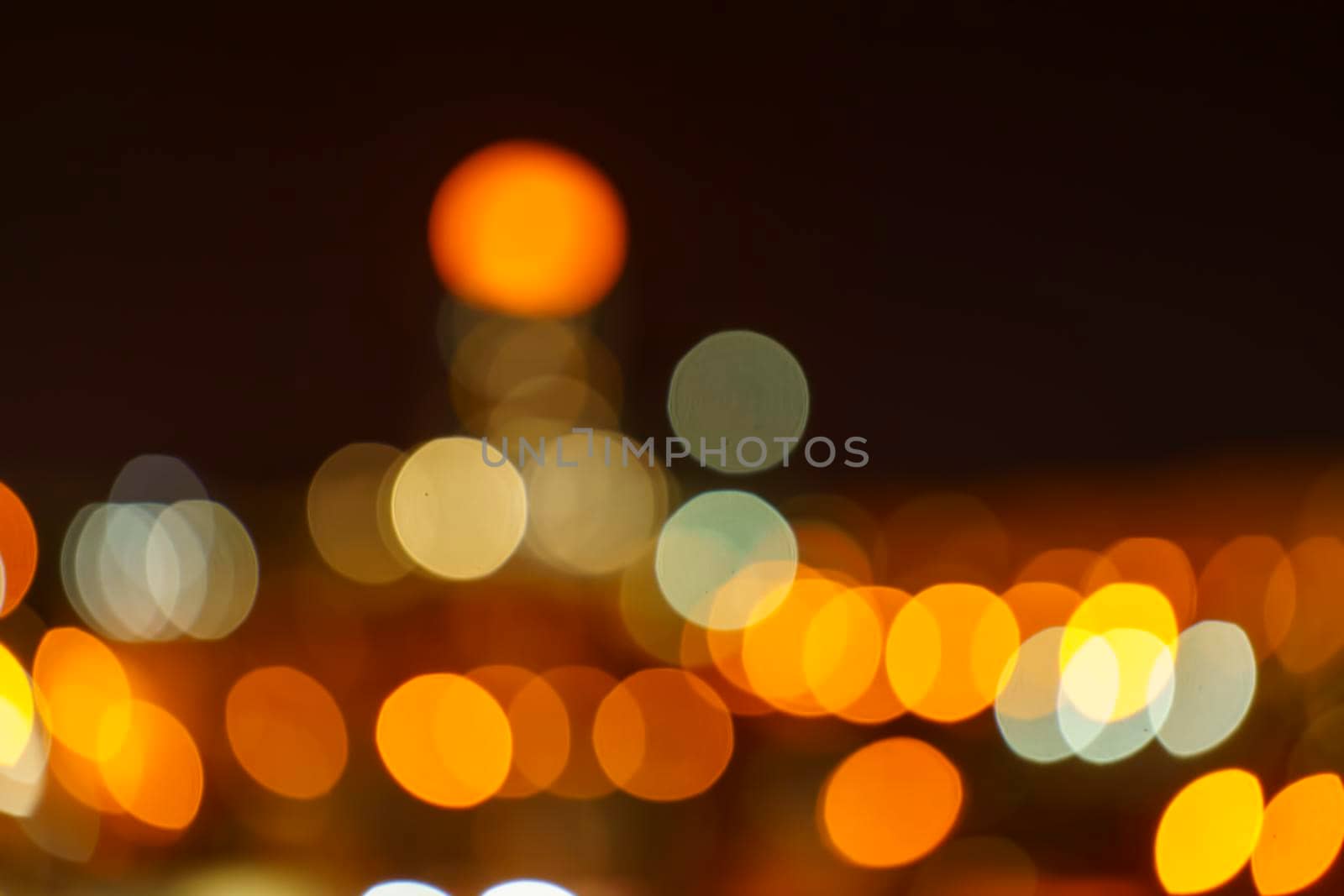 Dark blurry background with multi-colored bokeh